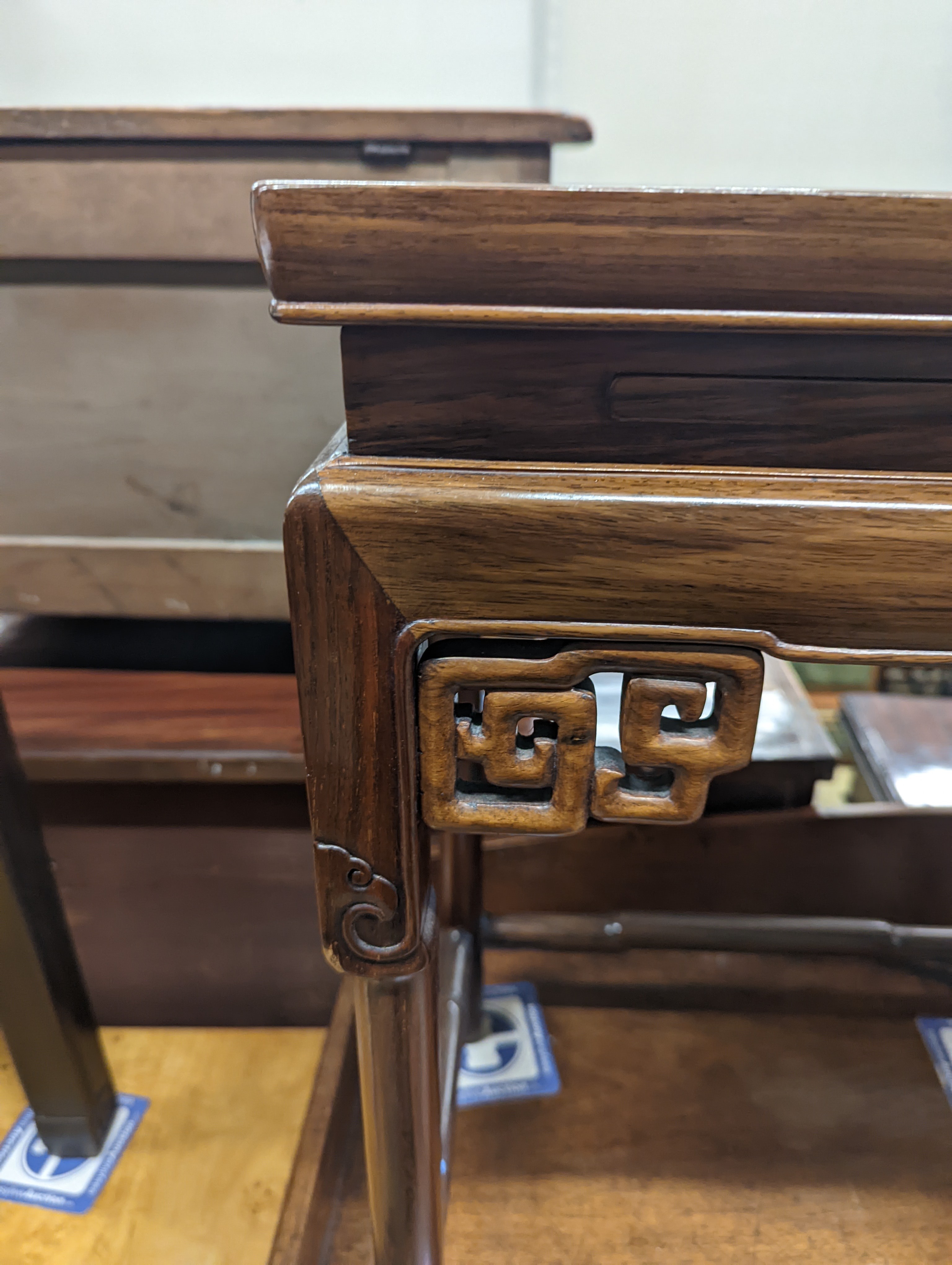 A nest of three Chinese rectangular tea tables, width 61cm, depth 36cm, height 66cm